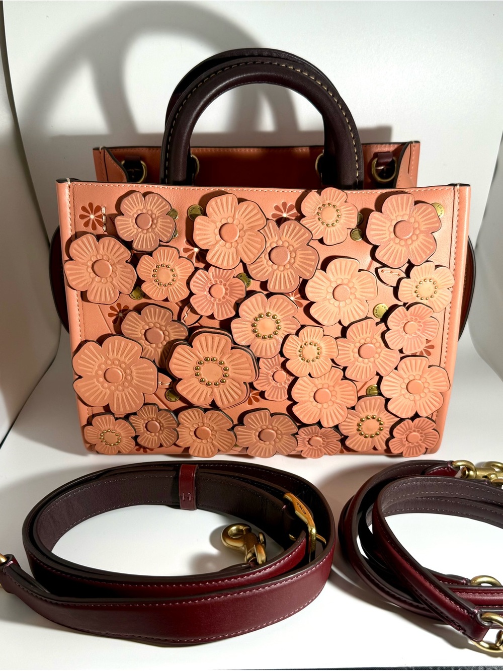 Coach Peach Floral Rogue 25